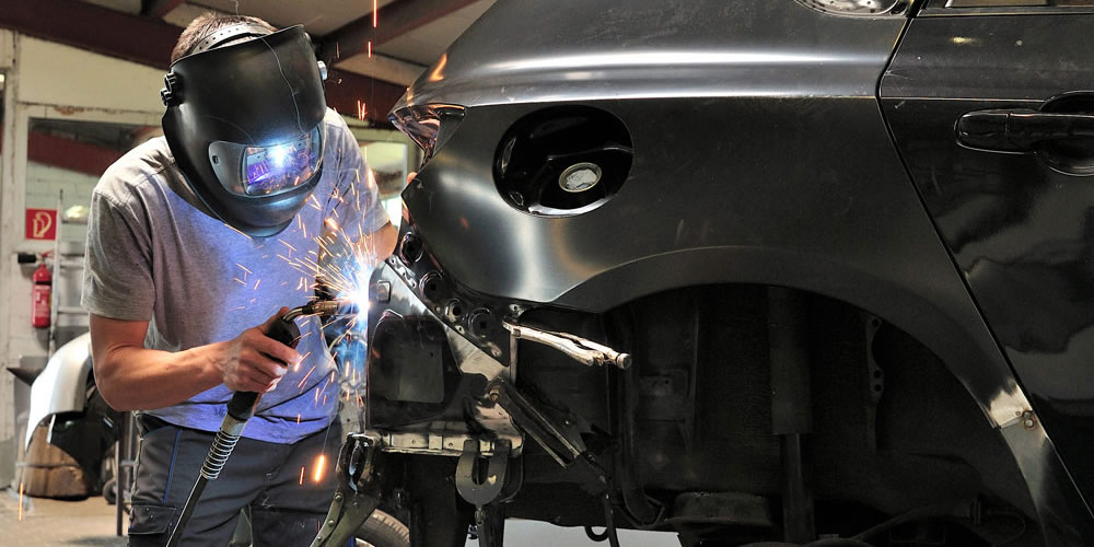 Image Of Car's Body Being Painted White